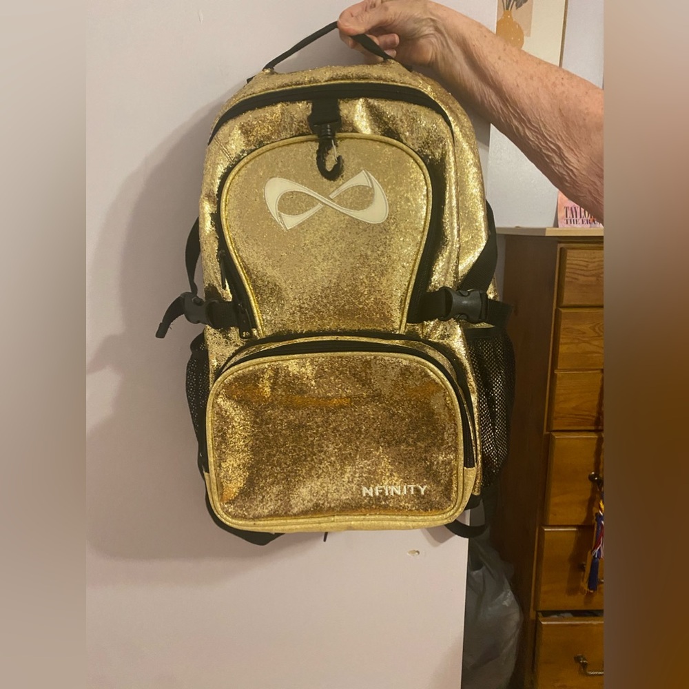 Nfinity cheer backpack in perfect condition! Gold glitter limited edition